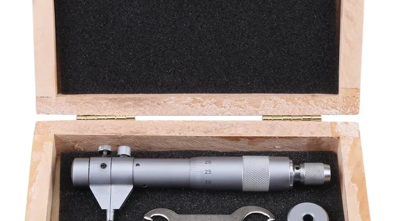 Micrometer tool in a wooden case with foam padding